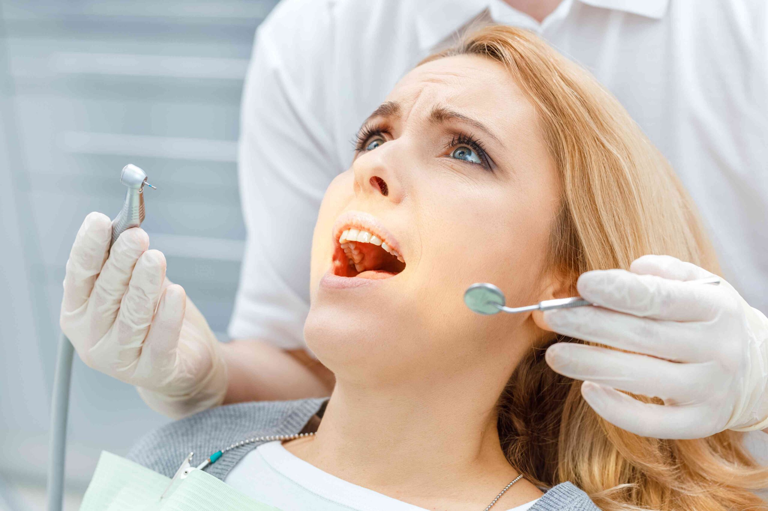 Patient receiving an emergency dental examination.